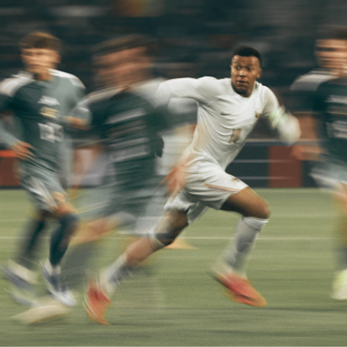 Footballer sprinting at full pace